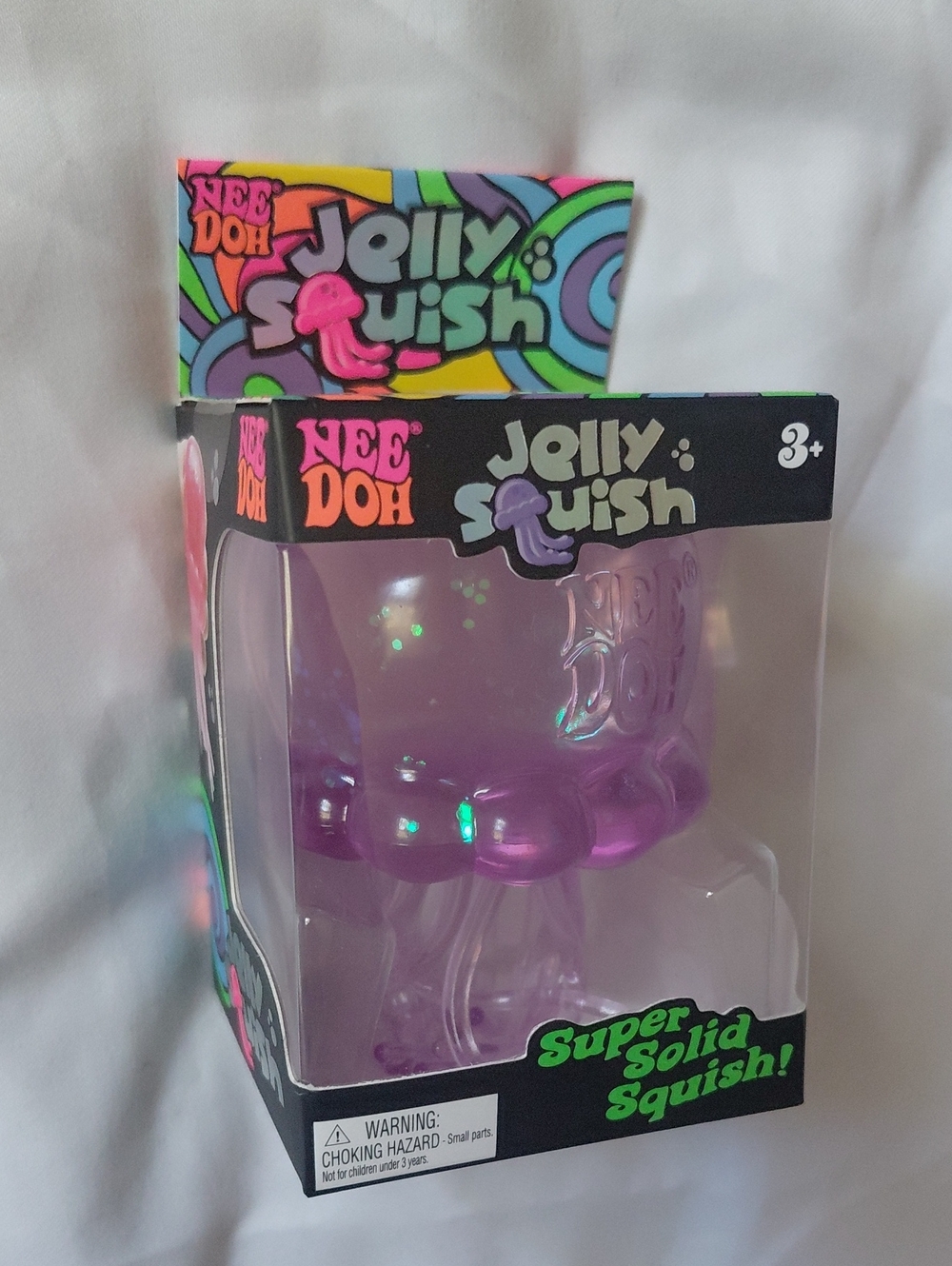 Schylling NeeDoh Jelly Squish Purple Glitter